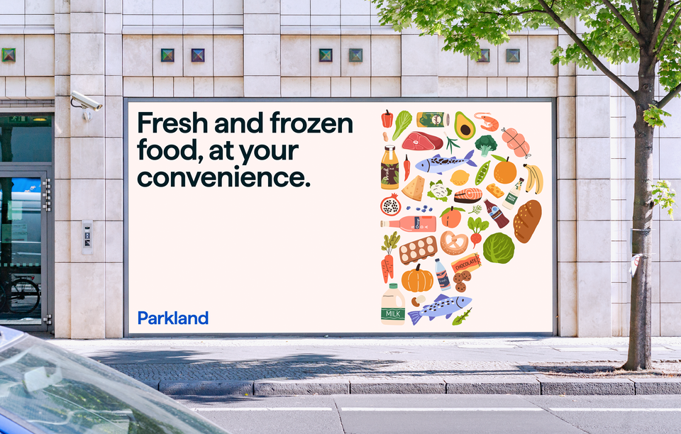 An urban billboard with the text Fresh and frozen food, at your convenience. Illustrations of various fresh and frozen items form the shape of the Parkland P logo