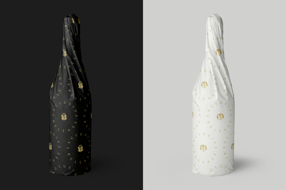 two bottles of wine wrapped in tissue paper printed with the Two Sisters logo and the text Exclusive Release