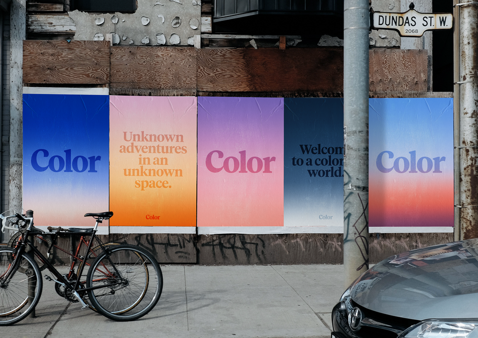Five posters on an abandoned building. On three of the posters is the word Color. On the second poster is the phrase Unknown Adventures in an Unknown Space. On the fourth poster is the phrase Welcome to a Colorful World.